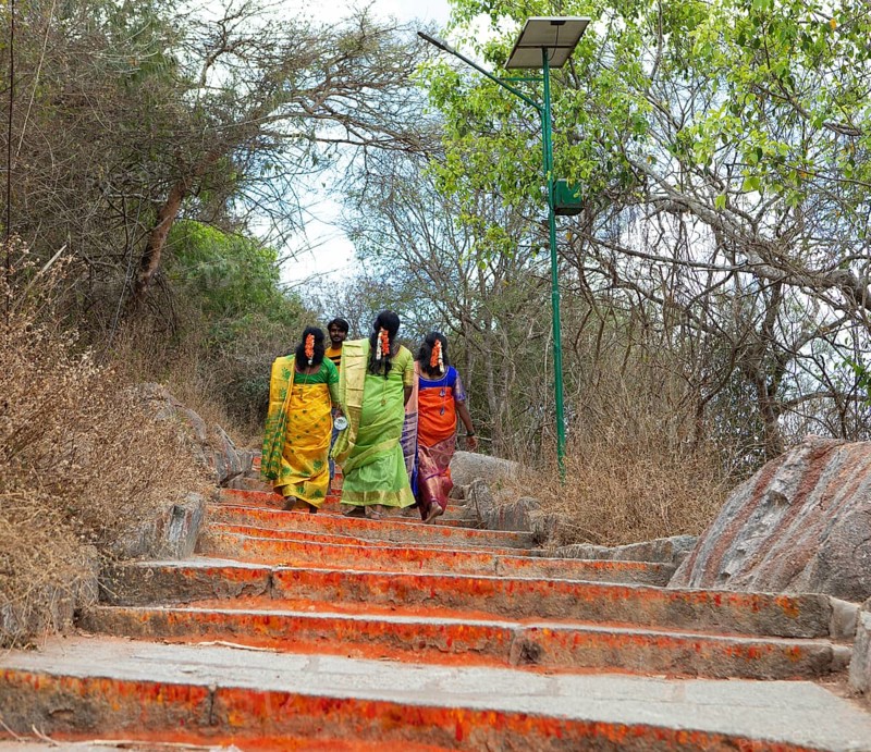 Indian pilgrims on the red steps to Chamundi Hill, Mysuru or Mysore, Karnataka, India