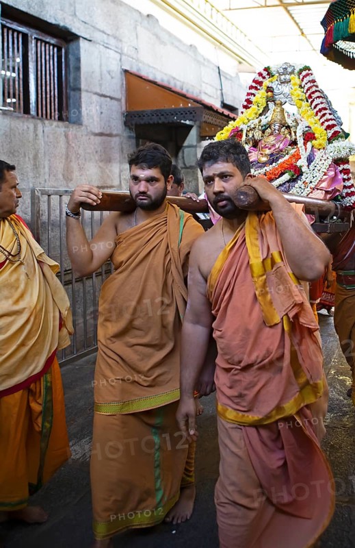 Puja at Chamundeswar Hindu Temple on Chamundi Hill, Indian men wear the statue of a Hindu goddess, Mysore or Mysore, Karnataka, India