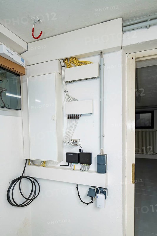 Network and communication distributor with patch panel, switch and properly routed cables, house renovation, climate renovation, Metzingen, Germany