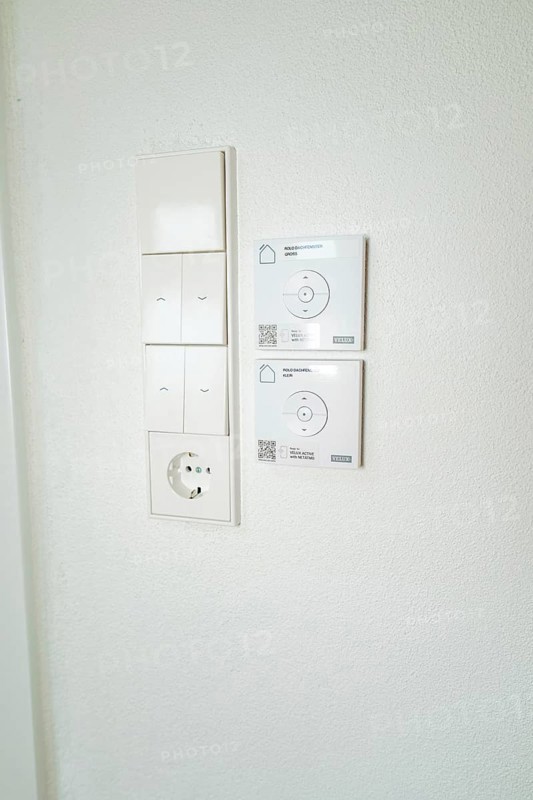 Wall panel with light switches, power outlet and smart home control in simple white, house renovation, climate renovation, Metzingen, Germany