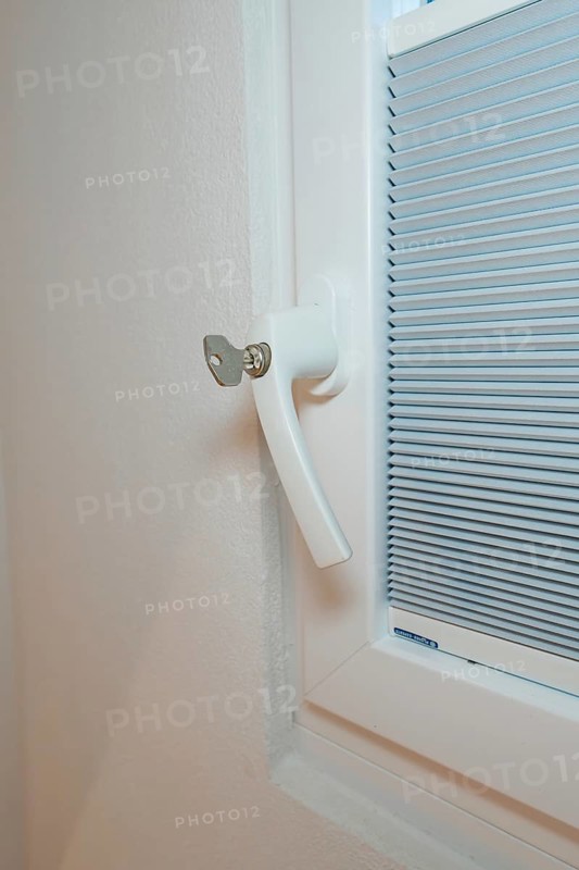 Detail of a white window handle with integrated blind, clean and modern, house renovation, climate renovation, Metzingen, Germany