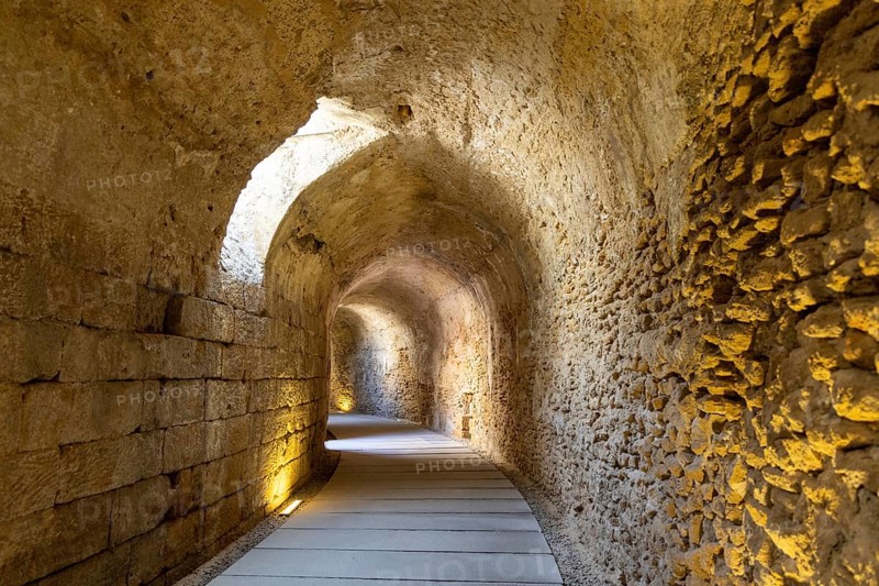 An old historic theatre in the middle of a city. Access tunnel to seats. The ruin was uncovered, Teatro Romano de Cadiz, Andalusia, Spain