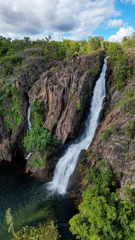 A waterfall and it´s pond in a remote are in Northern Territory Australia, photograped with a drone