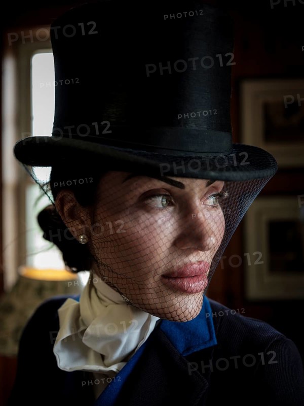 A rider from the Toronto North York Hunt Club, dressed in traditional hunting clothes, prior to a club event on August 26, 2025, in Mulmer, Ontario, Canada