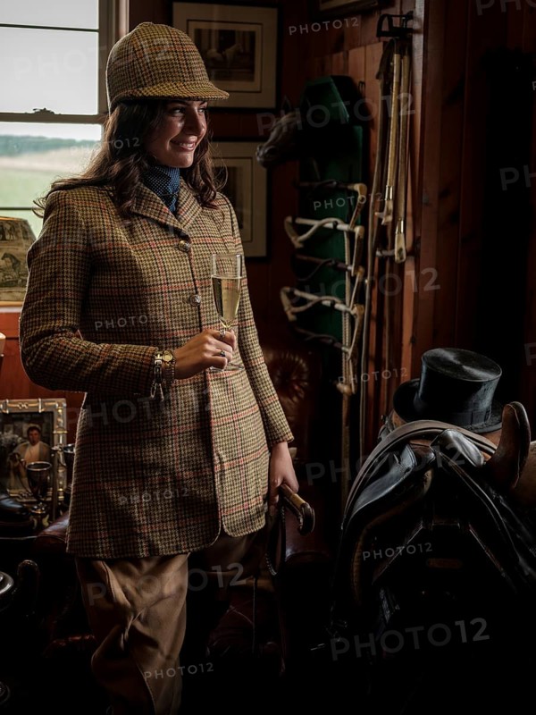 A rider from the Toronto North York Hunt Club, dressed in traditional hunting clothes, prepares ahead of a ride on August 26, 2025, in Mulmer, Ontario, Canada