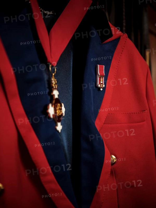 A riding jacked adorned with commemorative medals hang in the tack room at the Toronto North York Hunt Club on August 26, 2025 in Mulmer, Ontario, Canada