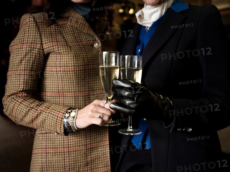 Members of the Toronto North York Hunt Club, dressed in traditional hunting clothes, enjoy a glass of champagne before a ride on August 26, 2025, in Mulmer, Ontario, Canada