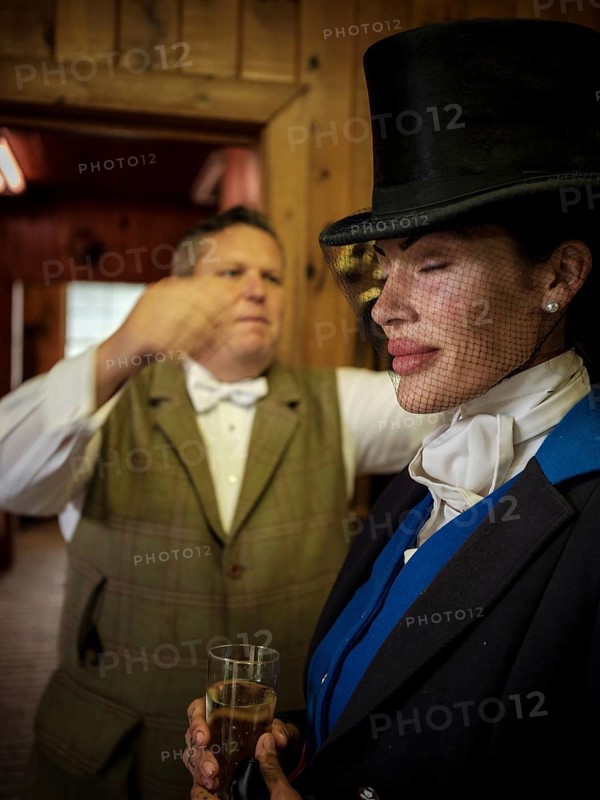 Members of the Toronto North York Hunt Club, dressed in traditional hunting clothes, prepare ahead of a ride on August 26, 2025, in Mulmer, Ontario, Canada
