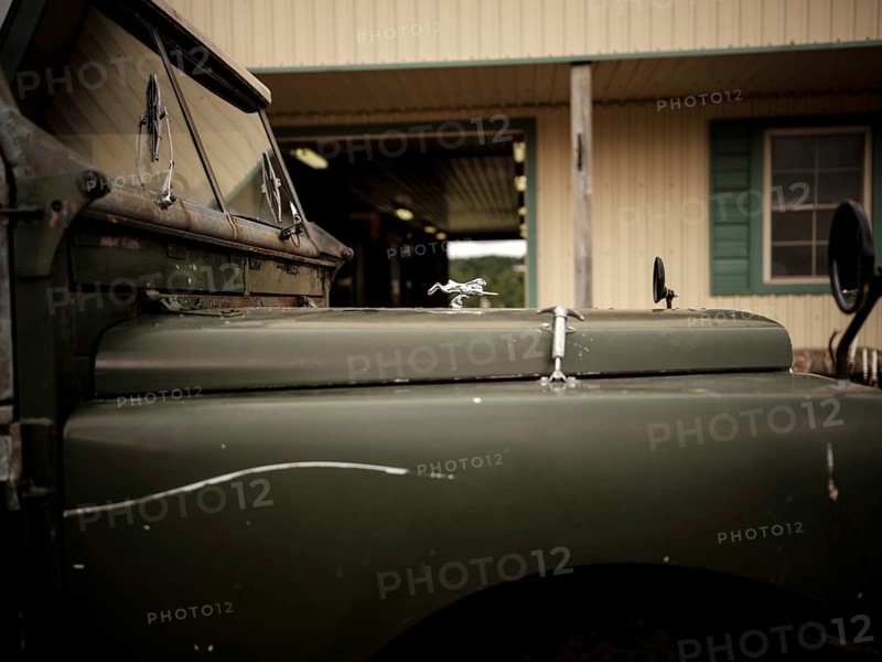 The front end of a 1950's Series One Land Rover, parked at the Toronto North York Hunt Club in Mulmer, Ontario, Canada