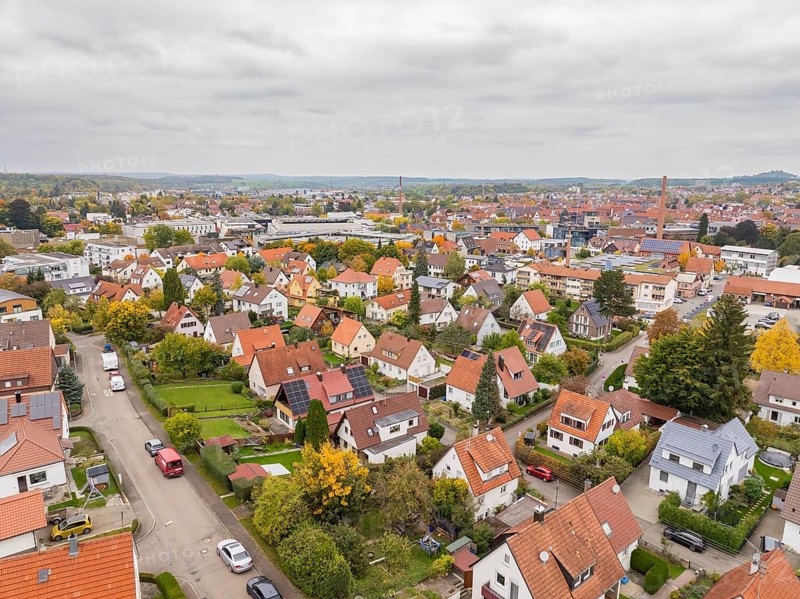 Quiet residential area in autumn seen from above under grey skies, Metzingen, Germany