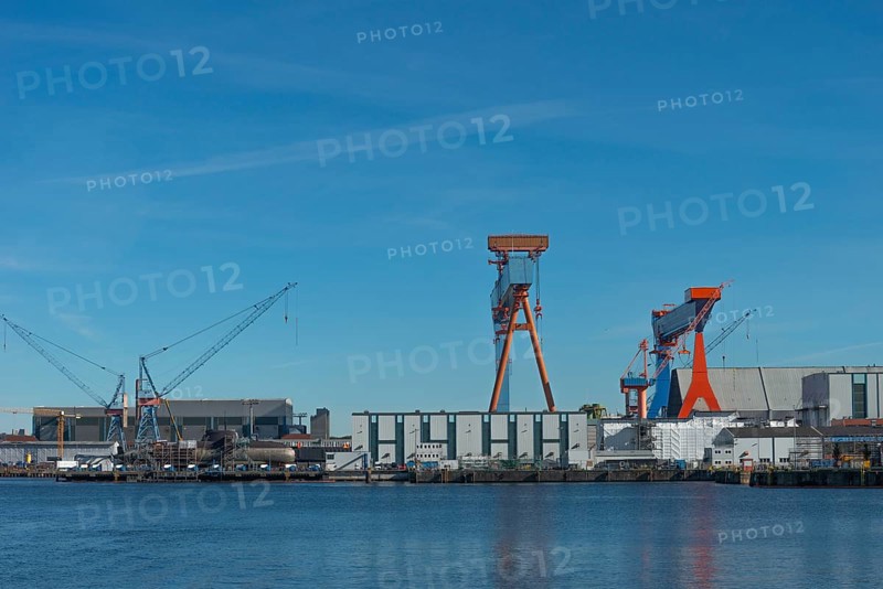 Shipyards with docks in Kiel port, equipped submarine under construction, armament, Thyssen Krupp subsidiary TKMS Dock (left), stock exchange, cranes, Kiel Fjord, Schleswig-Holstein, Germany