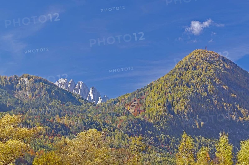 Autumn alpine slopes with round and jagged peaks under clear, deep blue sky, Lienz Dolomites, Drau cycle path, Tyrol, Austria