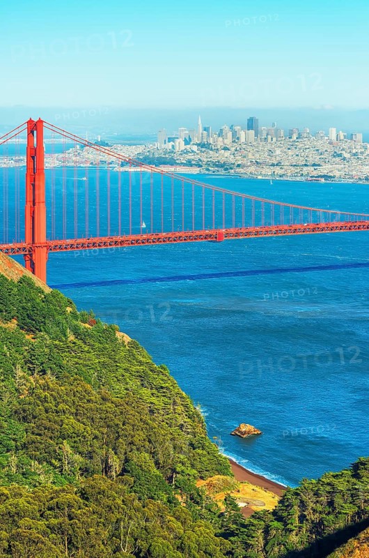 View of Golden Gate Bridge and financial district in the distance, San Francisco, California, USA