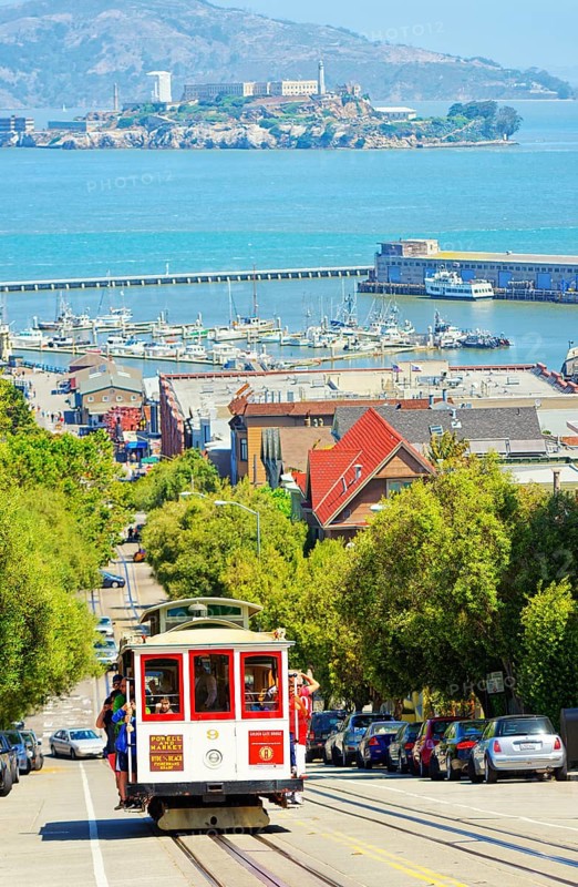 Powell-Hyde line cable car with Alcatraz Island in the background, San Francisco, California, USA