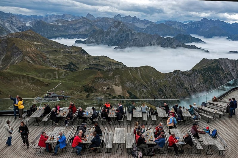 Restaurant at the Nebelhorn summit with views of the Allgäu Alps, mountains rising from fog in the valley, Oberstdorf, Oberallgäu, Allgäu, Bavaria, Germany