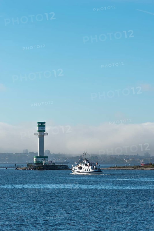 Green-white lighthouse Friedrichsort with city panorama of the state capital, Kiel Fjord, Kiel, haze bell, shipping, tower, architecture, landmark, orientation, navigation, shipping, blue sky, Schleswig-Holstein, Germany