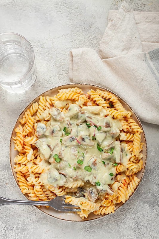Fusilli pasta, with champignons, in creamy garlic sauce, with herbs and spices, sauce, no people