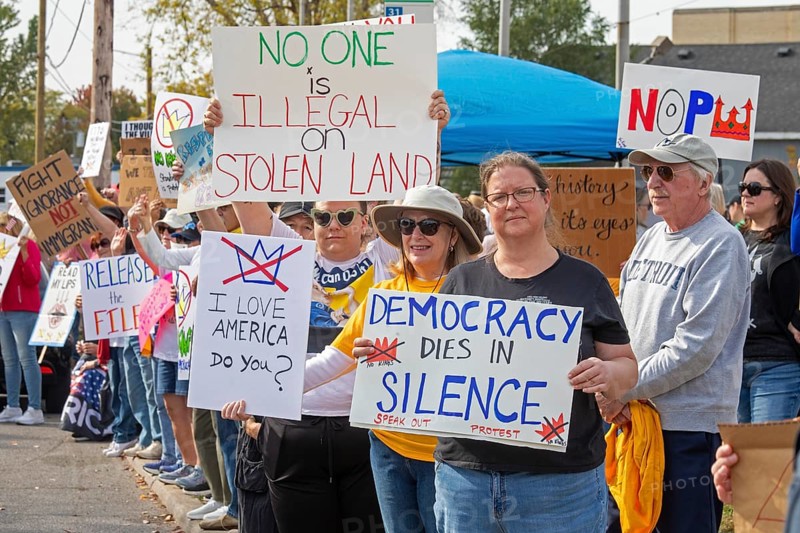 Detroit, Michigan USA - 18 October 2025 - Protesters from Detroit and Grosse Pointe gathered on the border between their cities for a 'No Kings' rally, protesting President Trump's actions against immigrants and against democratic institutions
