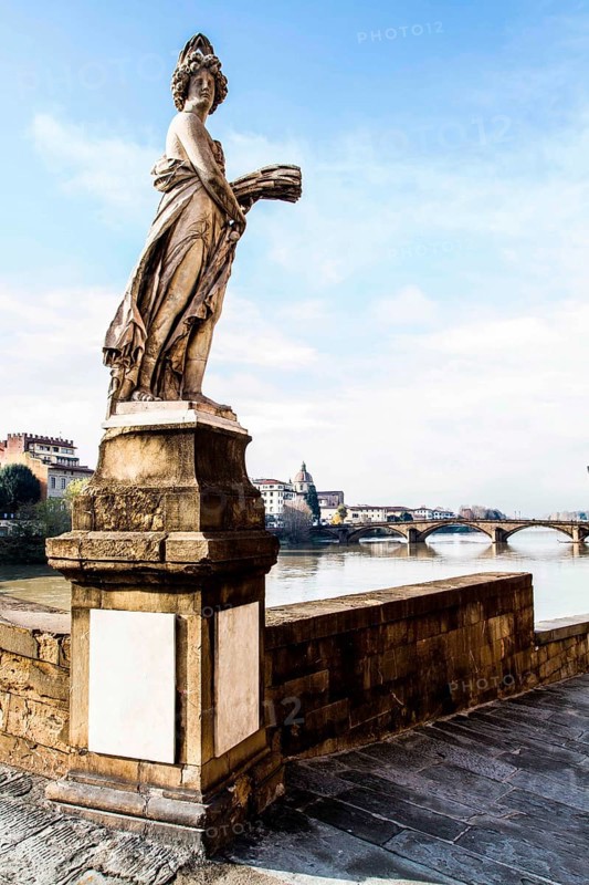 Detail of Ponte Santa Trinita (Holy Trinity Bridge), the oldest elliptic arch bridge in the world, and Ponte Alla Carraia in the background. Florence, Province of Florence, Italy