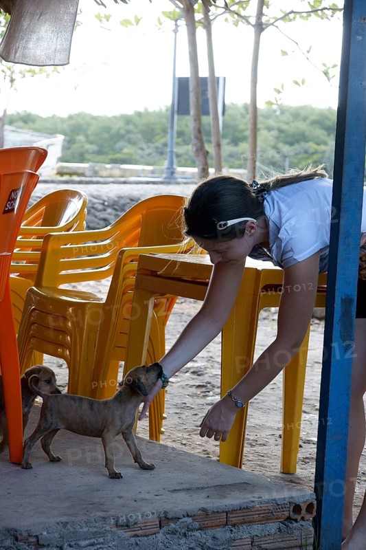 Woman Playing with Dog, Alcântara, Maranhão, Brazil