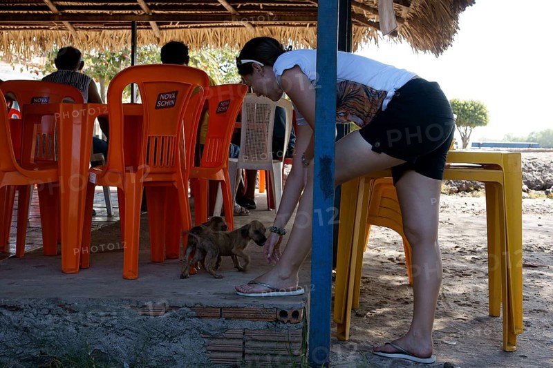 Woman Playing with Dog, Alcântara, Maranhão, Brazil