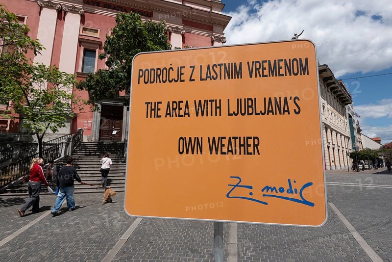Sign on artificial rain system on Prešeren Square, Ljubljana, Slovenia