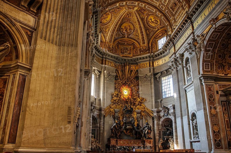 View of the main apse of St. Peter's Basilica with stylized larger-than-life bronze throne reliquary for wooden chair decorated with ivory plates Catheda Petri alleged chair of Simon Peter, Basilica of St. Peter, Vatican, Rome, Lazio, Italy