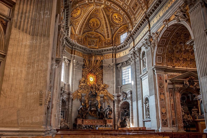 View of in the main apse of St. Peter's Basilica with stylized larger-than-life bronze throne reliquary for wooden chair decorated with ivory plates Catheda Petri alleged chair of Simon Peter, Basilica of St. Peter, Vatican, Rome, Lazio, Italy
