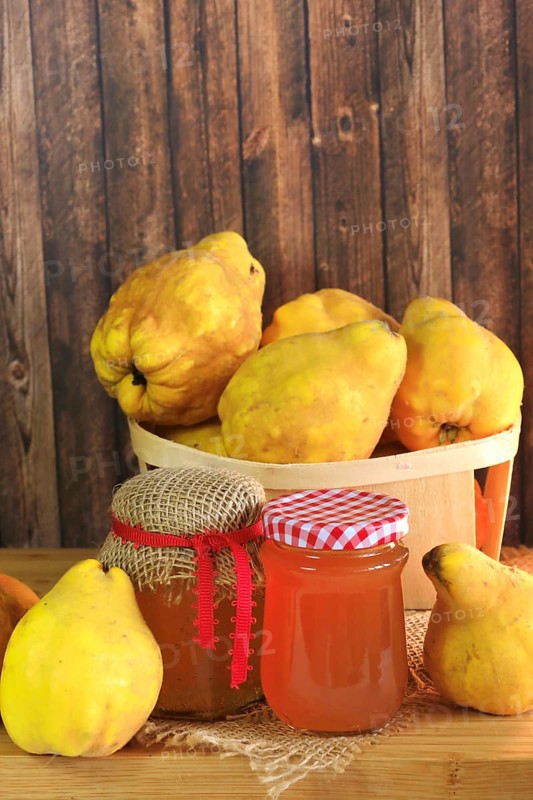 Picturesque still life with quince and quince jelly in a glass, autumn, Germany