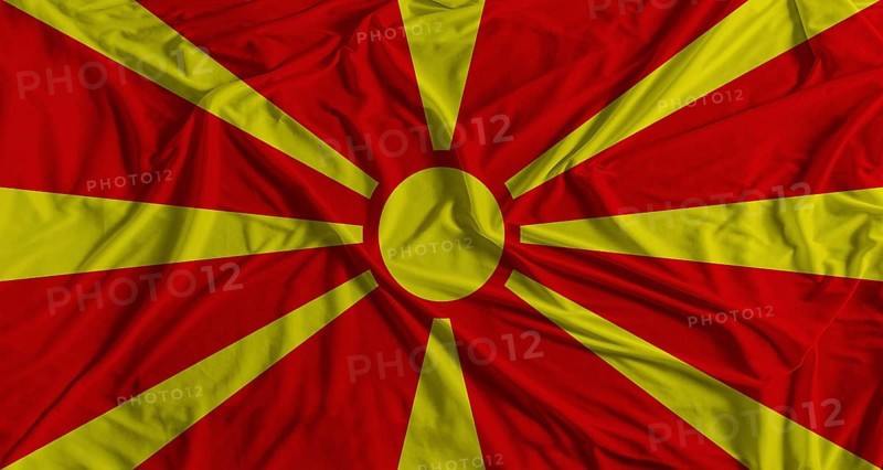 Macedonian flag with fabric texture background. National flag of North Macedonia with cloth texture
