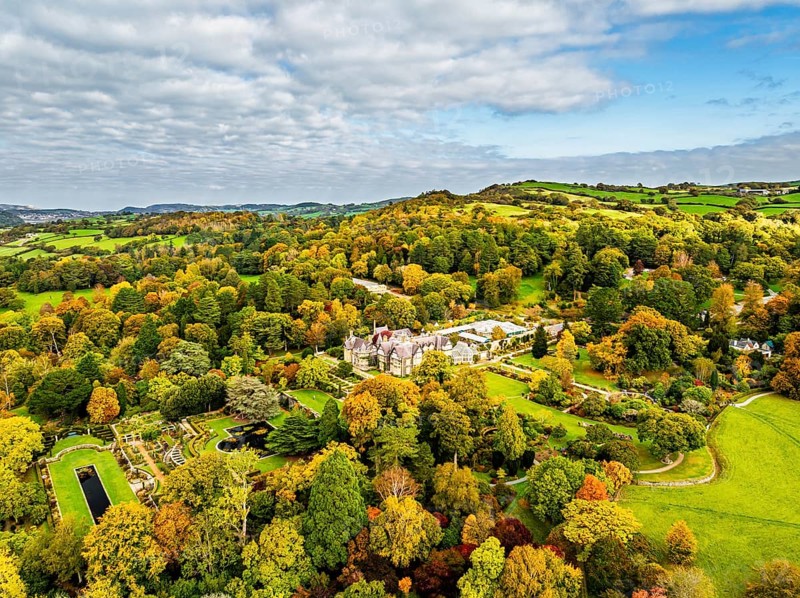 Autumn colours over Bodnant House and Garden from a drone, Conwy River, Colwyn Bay, Conwy, Wales, England, United Kingdom