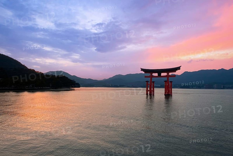 Japan, Miyajima, or Itsukushima, a semirural island with an iconic floating shrine with a giant red torii gate