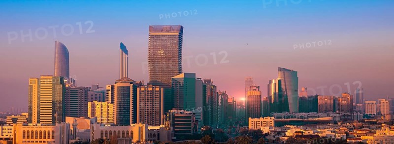 UAE, United Arab Emirates, Abu Dhabi downtown panorama and financial center skyline at sunset