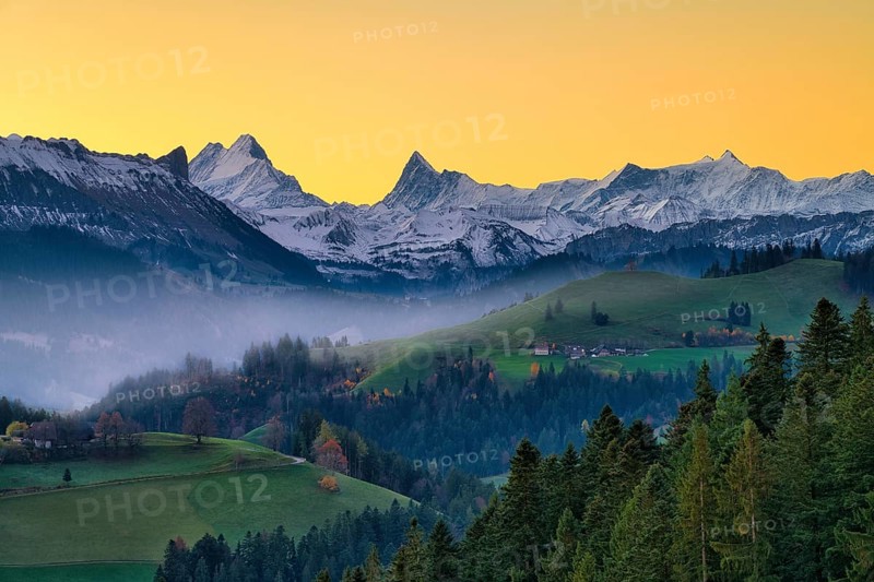 View of snow-covered Bernese Alps with Schreckhorn and Finsteraarhorn at dawn, Langnau im Emmental, Canton of Bern, Switzerland