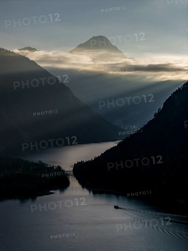 Mountain lake, mountains, sunrays, back light, fog, boat, sightseeing boat, evening light, Plansee, Tyrol, Austria