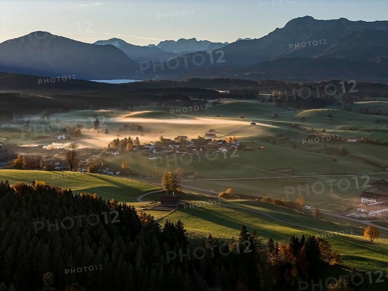 Village, mountains, sunny, morning light, autumn, autumn color, fog, aerial view, back light, Riegsee, Upper Bavaria, Bavaria, Germany