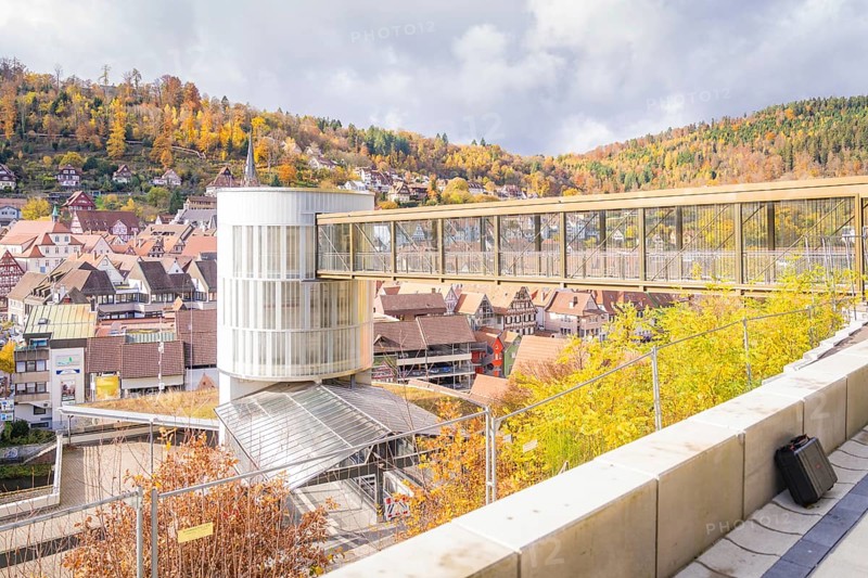 Bridge overlooking a town with autumn leaves and on a sunny day, ZOB Calw, Hermann Hessebahn, Calw, Germany
