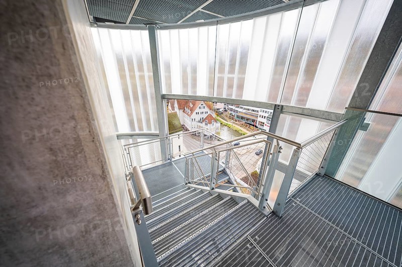 Staircase inside a building with a view of the city and roof landscape, ZOB Calw, Hermann Hessebahn, Calw, Germany