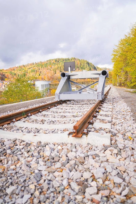 Railway line with rail stopper in autumn landscape under cloudy sky, ZOB Calw, Hermann Hessebahn, Calw, Germany