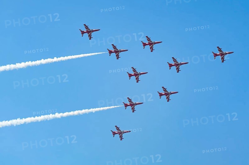 The Indian Air Force (IAF) Surya Kiran aerobatics team performs during an air show as part of the 93rd Air Force Day celebrations on November 8, 2025 in Guwahati, India