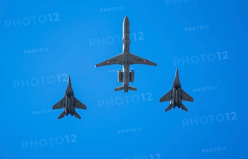 An Indian Air Force Netra AEW&C aircraft flies in formation with two MiG-29 fighter jets during an air show as part of the 93rd Air Force Day celebrations on November 8, 2025 in Guwahati, India