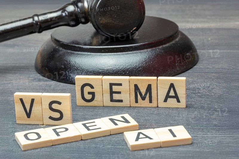 Letter cubes in front of a judge's hammer show the words GEMA VS OPEN AI