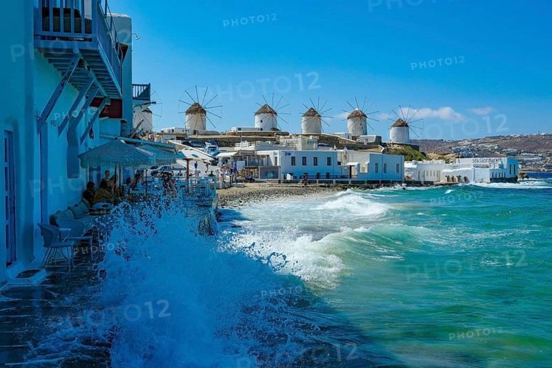 Mykonos, Cyclades, Greece - The six sixteenth-century windmills, lined up on a hill above Mykonos Town, Mykonos Chora, are the island's landmark. Mykonos is part of the Cyclades archipelago in the Aegean Sea