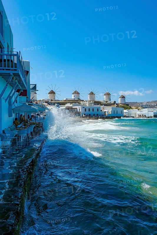 Mykonos, Cyclades, Greece - The six sixteenth-century windmills, lined up on a hill above Mykonos Town, Mykonos Chora, are the island's landmark. Mykonos is part of the Cyclades archipelago in the Aegean Sea