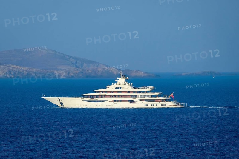 Mykonos, Cyclades, Greece - The Alaiya is a 111.5 meter long luxury motor yacht built in 2019 by the German shipyard Lürssen. It accommodates up to 18 guests in 9 cabins and is owned by Indian steel magnate Lakshmi Mittal. The yacht is equipped with ice-class equipment, a helipad, a private owner area and a cinema room