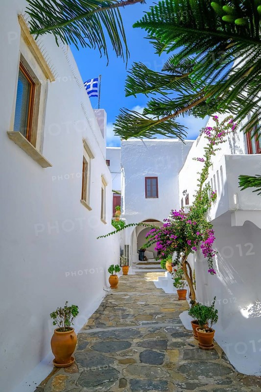 Ano Mera, Mykonos, Cyclades, Greece - The Panagia Tourliana monastery is the center of Ano Mera. The 16th century men's convent on the village square in the interior of the island is now a tourist attraction much visited by tourists