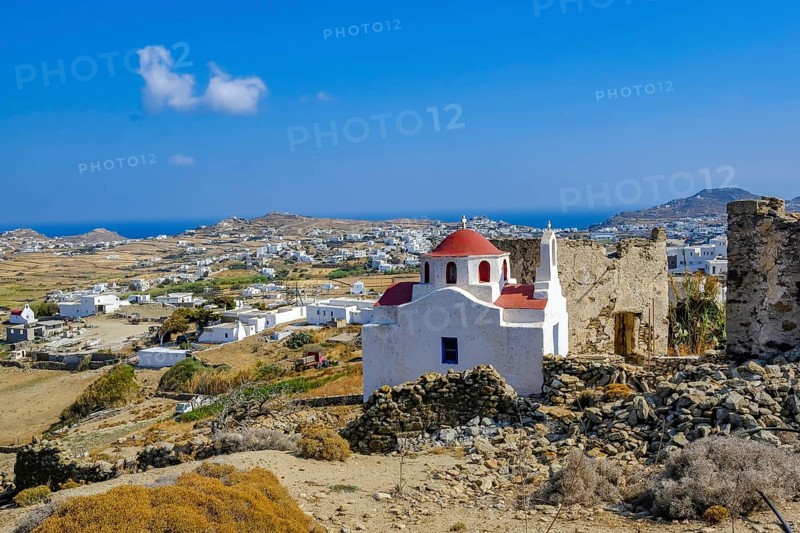 Ano Mera, Mykonos, Cyclades, Greece - Small church from the 18th century on the site of the Gyzi ruins, 13th century castle ruins by the Venetian Gyzi family, right next to the Paleokastro monastery in the interior of the island just outside Ano Mera, is now a tourist attraction much visited by tourists
