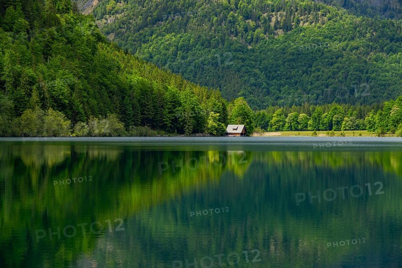 Landscape of Lake Offensee after rain when the sun comes through the clouds in spring, Salzkammergut, Austria