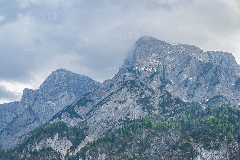 View into the mountains next to Lake Traunsee on a rainy day in spring, Traunstein summit, Traunkirchen, Salzkammergut, Austria