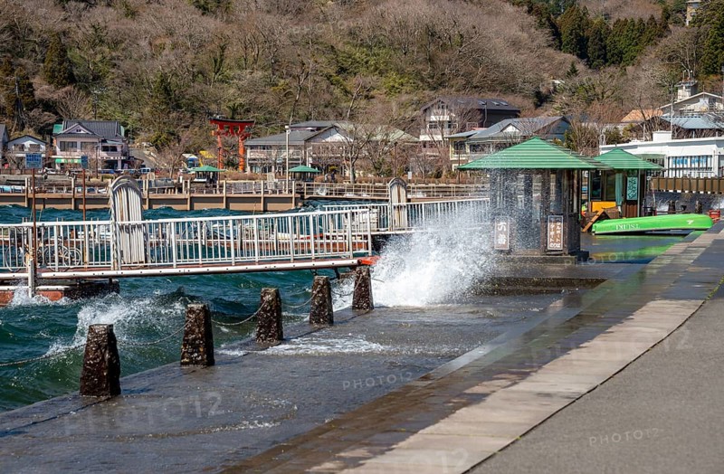 Water splashes on the waterfront of Lake Ashi in Motohakone, Hakone, Japan
